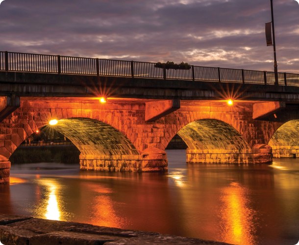 The bridge at Lanesborough lit at night, home of Lough Ree Distillery